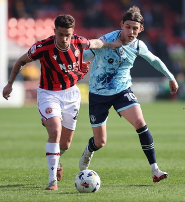 210326 - Walsall v Newport County - Sky Bet League 2 - Harrison Biggins of Newport and Alfie Young of Walsall FC
