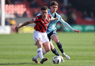 210326 - Walsall v Newport County - Sky Bet League 2 - Harrison Biggins of Newport and Alfie Young of Walsall FC