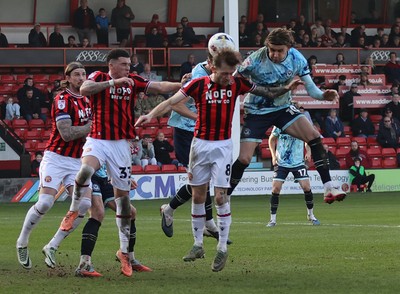 210326 - Walsall v Newport County - Sky Bet League 2 - Harrison Biggins of Newport tries to head towards goal