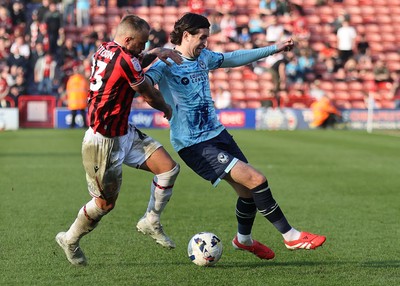 210326 - Walsall v Newport County - Sky Bet League 2 - Harrison Biggins of Newport and Alex Pattison of Walsall FC
