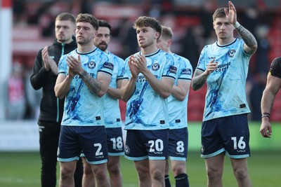 210326 - Walsall v Newport County - Sky Bet League 2 - Cameron Evans of Newport, Liam Shephard of Newport, Ben Lloyd of Newport, Matthew Smith of Newport, James Crole of Newport applaud the fans at the end of the match