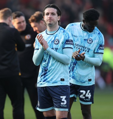 210326 - Walsall v Newport County - Sky Bet League 2 - Anthony Glennon of Newport leads team to applaud fans at the end of the match