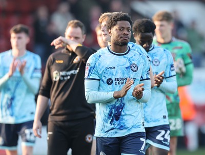 210326 - Walsall v Newport County - Sky Bet League 2 - Bobby Kamwa of Newport leads team to applaud fans at the end of the match