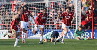 210326 - Walsall v Newport County - Sky Bet League 2 - Tom Davies of Newport and Goalkeeper Jordan Wright are floored while Alex Pattison of Walsall FC celebrates by taking off his shirt [Yellow card]