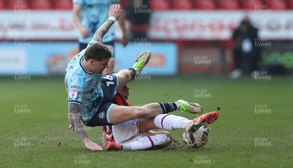 210326 - Walsall v Newport County - Sky Bet League 2 - James Crole of Newport falls over Rico Browns of Walsall FC
