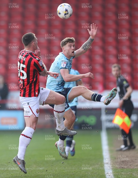 210326 - Walsall v Newport County - Sky Bet League 2 - Cameron Evans of Newport and Kacper Lopata of Walsall FC