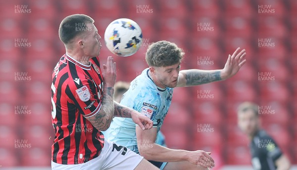 210326 - Walsall v Newport County - Sky Bet League 2 - Cameron Evans of Newport and Kacper Lopata of Walsall FC