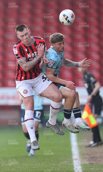 210326 - Walsall v Newport County - Sky Bet League 2 - Cameron Evans of Newport and Kacper Lopata of Walsall FC
