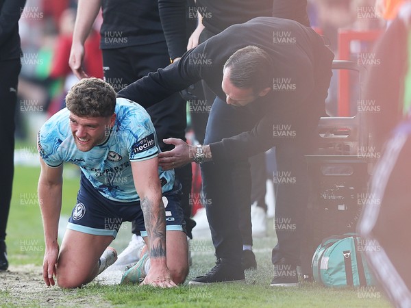 210326 - Walsall v Newport County - Sky Bet League 2 - Cameron Evans of Newport is helped up by a concerned Newport manager Christian Fuchs