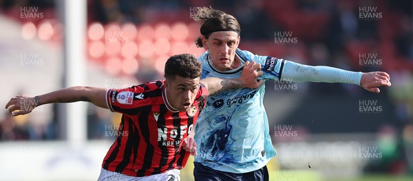 210326 - Walsall v Newport County - Sky Bet League 2 - Harrison Biggins of Newport and Alfie Young of Walsall FC