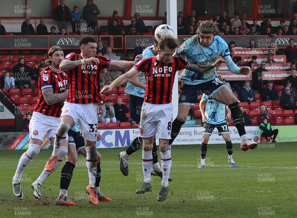 210326 - Walsall v Newport County - Sky Bet League 2 - Harrison Biggins of Newport tries to head towards goal