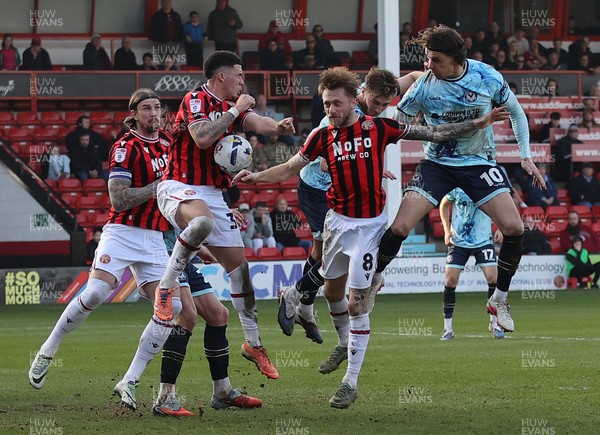 210326 - Walsall v Newport County - Sky Bet League 2 - Harrison Biggins of Newport tries to head towards goal