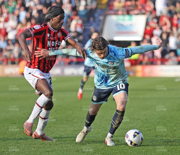 210326 - Walsall v Newport County - Sky Bet League 2 - Harrison Biggins of Newport and Jid Okeke of Walsall FC