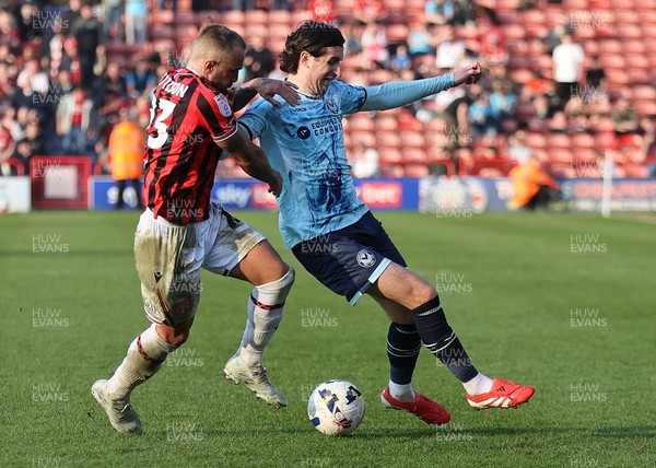 210326 - Walsall v Newport County - Sky Bet League 2 - Harrison Biggins of Newport and Alex Pattison of Walsall FC