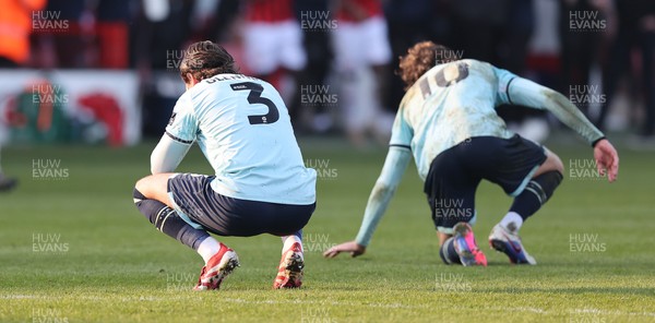 210326 - Walsall v Newport County - Sky Bet League 2 - Anthony Glennon of Newport and Harrison Biggins of Newport at the end of the match