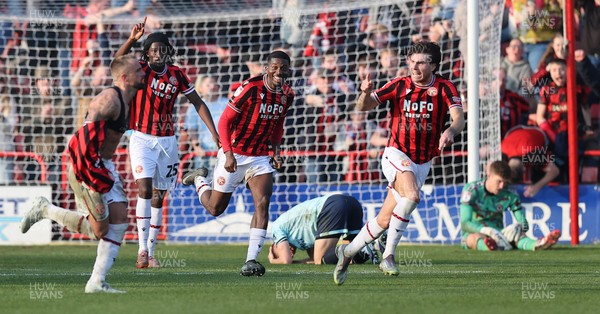 210326 - Walsall v Newport County - Sky Bet League 2 - Tom Davies of Newport and Goalkeeper Jordan Wright are floored while Alex Pattison of Walsall FC celebrates by taking off his shirt [Yellow card]