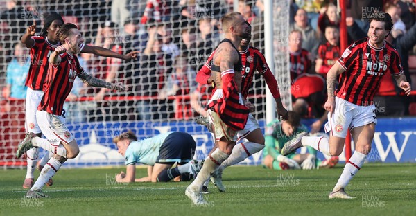 210326 - Walsall v Newport County - Sky Bet League 2 - Tom Davies of Newport and Goalkeeper Jordan Wright are floored while Alex Pattison of Walsall FC celebrates by taking off his shirt [Yellow card]