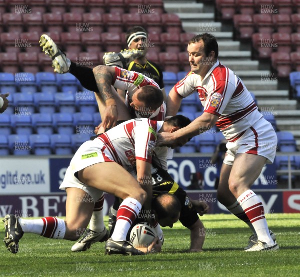 19.04.09 - Wigan Warriors v Celtic Crusaders - Super League -  Crusaders Adam Peek is speartackled by Wigan's Gareth Hock and Pat Richards.  