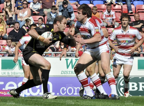 19.04.09 - Wigan Warriors v Celtic Crusaders - Super League -  Crusaders Adam Peek, left, is tackled by Wigan's Andy Coley  