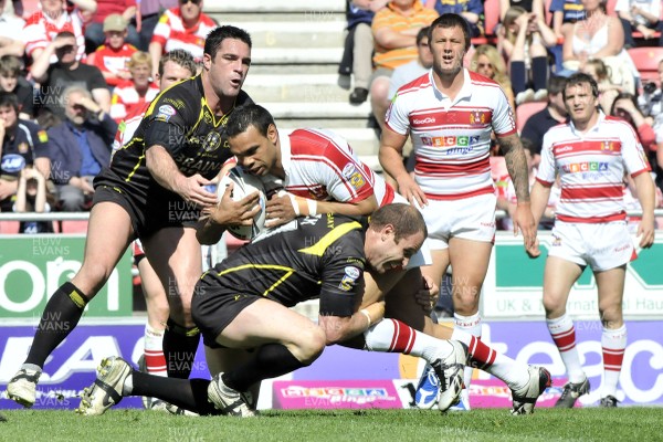 19.04.09 - Wigan Warriors v Celtic Crusaders - Super League -  Crusaders Adam Budworth, left and Adam Peek combine to tackle Wigan's Amos Roberts. 