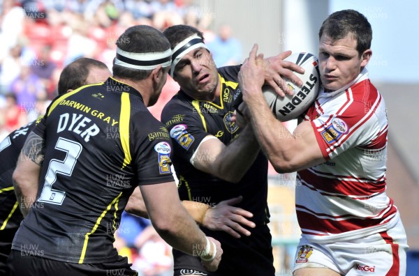 19.04.09 - Wigan Warriors v Celtic Crusaders - Super League -  Crusaders Darren Mapp, centre, tackles Wigan's Stuart Fielden 