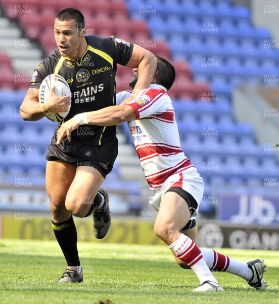 19.04.09 - Wigan Warriors v Celtic Crusaders - Super League -  Crusaders Jason Chan is tackled by Wigan's Thomas Leuluai 