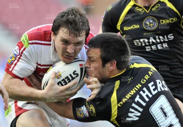 19.04.09 - Wigan Warriors v Celtic Crusaders - Super League -  Wigan's Martin Gleeson is tackled by Lincoln Withers  