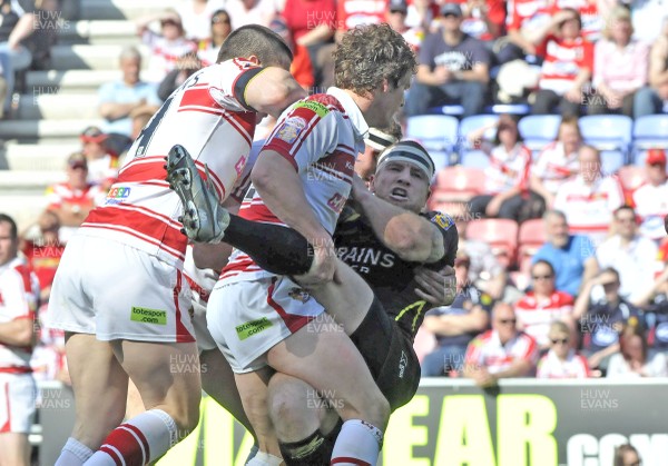 19.04.09 - Wigan Warriors v Celtic Crusaders - Super League -  Crusaders Luke Dyer is tackled by Wigan's Tim Smith, left and Sean 'Loughlin  