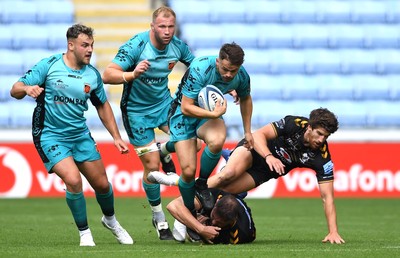 120921 - Wasps v Dragons - Preseason Friendly - Ioan Davies of Dragons is tackled by Elliott Stooke of Wasps