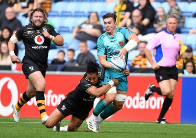 120921 - Wasps v Dragons - Preseason Friendly - Taine Basham of Dragons is tackled by Marcus Watson of Wasps