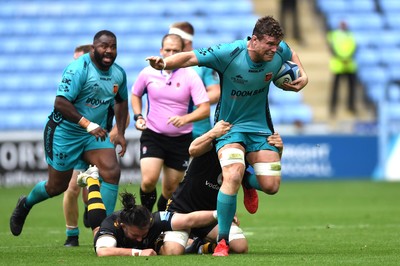 120921 - Wasps v Dragons - Preseason Friendly - Will Rowlands of Dragons is tackled by Thomas Young of Wasps