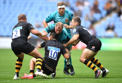 120921 - Wasps v Dragons - Preseason Friendly - Ross Moriarty of Dragons is tackled by Tom Cruse, Jacob Umaga and Jimmy Gopperth of Wasps