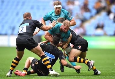 120921 - Wasps v Dragons - Preseason Friendly - Ross Moriarty of Dragons is tackled by Tom Cruse, Jacob Umaga and Jimmy Gopperth of Wasps