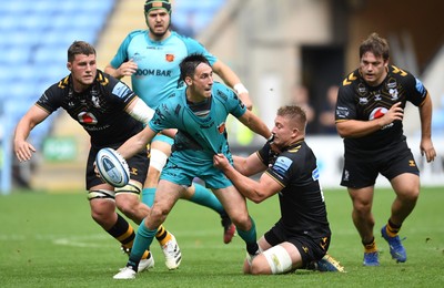 120921 - Wasps v Dragons - Preseason Friendly - Sam Davies of Dragons gets the ball away