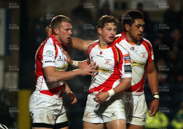 131012 London Wasps v Dragons - Amlin Challenge Cup - Jack Dixon of Dragons is congratulated on his try by team mates Toby Faletau and Liam Davies 