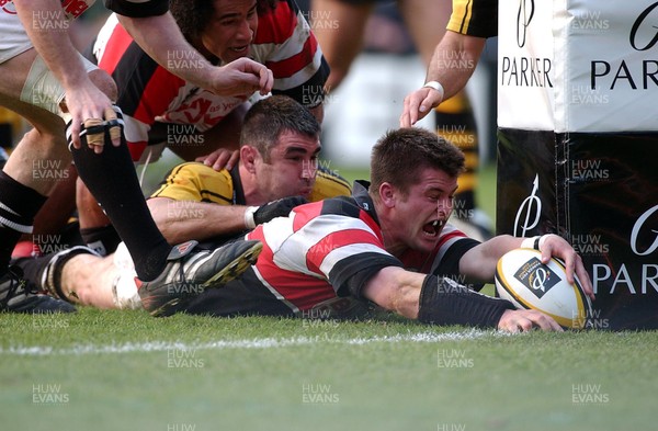 120403 - Wasps v Pontypridd - Parker Pen Cup Semi Final First Leg - Pontypridd's Ceri Sweeney celebrates as he grounds ball for try