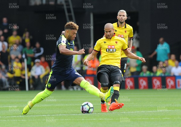 270816 - Watford V Arsenal - PremiershipAdiene Guedioura of Watford is challenged by Alex Oxlade Chamberlain of Arsenal