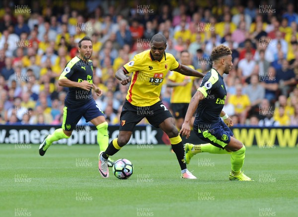 270816 - Watford V Arsenal - PremiershipOdion Ighalo of Watford goes around Arsenals Alex Oxlade Chamberlain