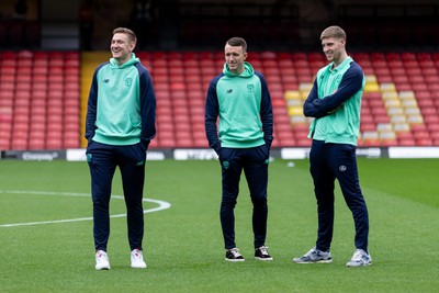 030224 - Watford v Cardiff City - Sky Bet League Championship - Matthew Turner (L), David Turnbull (C) and Mark McGuinness (R) of Cardiff City walk on the pitch prior to the kick off