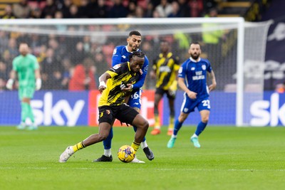 030224 - Watford v Cardiff City - Sky Bet League Championship - Jorge Cabezas of Watford  is challenged by Karlan Grant of Cardiff City