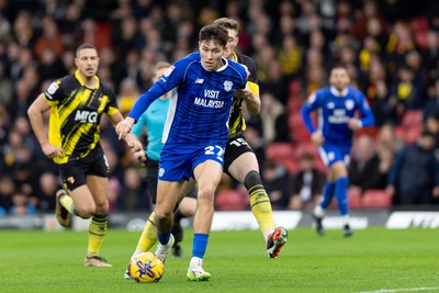 030224 - Watford v Cardiff City - Sky Bet League Championship - Rubin Colwill of Cardiff City is tackled by Mattie Pollock of Watford 