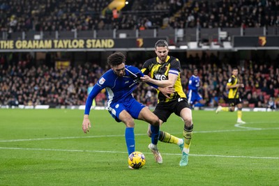 030224 - Watford v Cardiff City - Sky Bet League Championship - Kion Etete of Cardiff City is challenged by Wesley Hoedt of Watford 