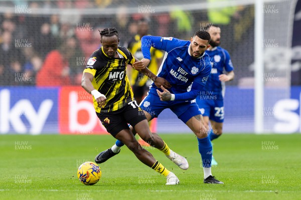 030224 - Watford v Cardiff City - Sky Bet League Championship - Jorge Cabezas of Watford  is challenged by Karlan Grant of Cardiff City