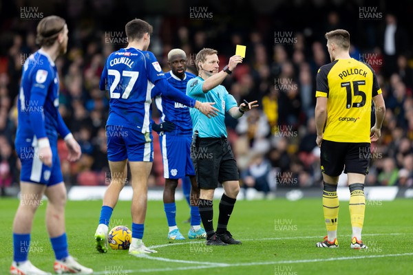 030224 - Watford v Cardiff City - Sky Bet League Championship - Mattie Pollock of Watford  is shown a yellow card by Match referee James Linington