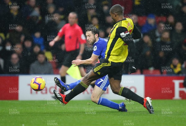 151218 - Watford v Cardiff City, Premier League - Harry Arter of Cardiff City crosses as Christian Kabasele of Watford closes in