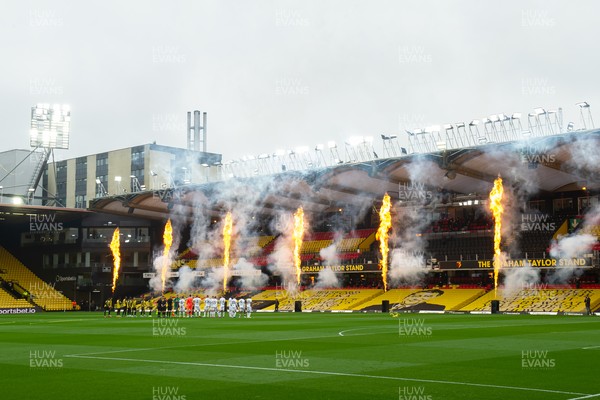 080521 - Watford v Swansea City - Sky Bet Championship - Swansea City players line up as fireworks are let off to celebrate Watford's promotion before the game