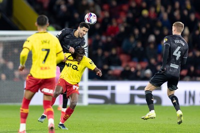 120325 - Watford v Swansea City - Sky Bet League Championship - Ben Cabango of Swansea City compete for the ball with Vakoun Issouf Bayo of Watford