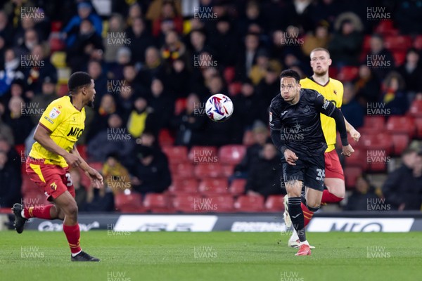 120325 - Watford v Swansea City - Sky Bet League Championship - Ronald of Swansea City and Yasser Larouci of Watford run to the ball