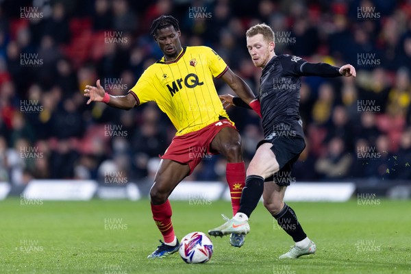 120325 - Watford v Swansea City - Sky Bet League Championship - Lewis O'Brien of Swansea City is challenged by Vakoun Issouf Bayo of Watford