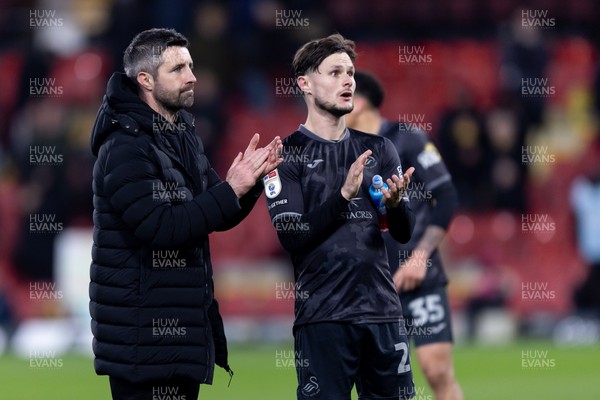 120325 - Watford v Swansea City - Sky Bet League Championship - Alan Sheehan manager of Swansea City and Liam Cullen of Swansea City applaud the fans after their side’s defeat